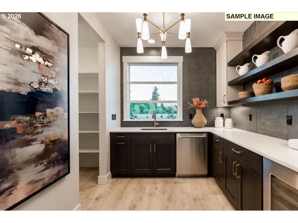a kitchen with stainless steel appliances a sink stove and cabinets