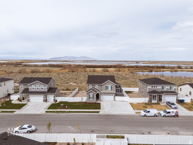540 Lefty Lane Tooele, UT 84074 - Photo 35 of 48 Aerial view of residential area featuring a water and mountain view