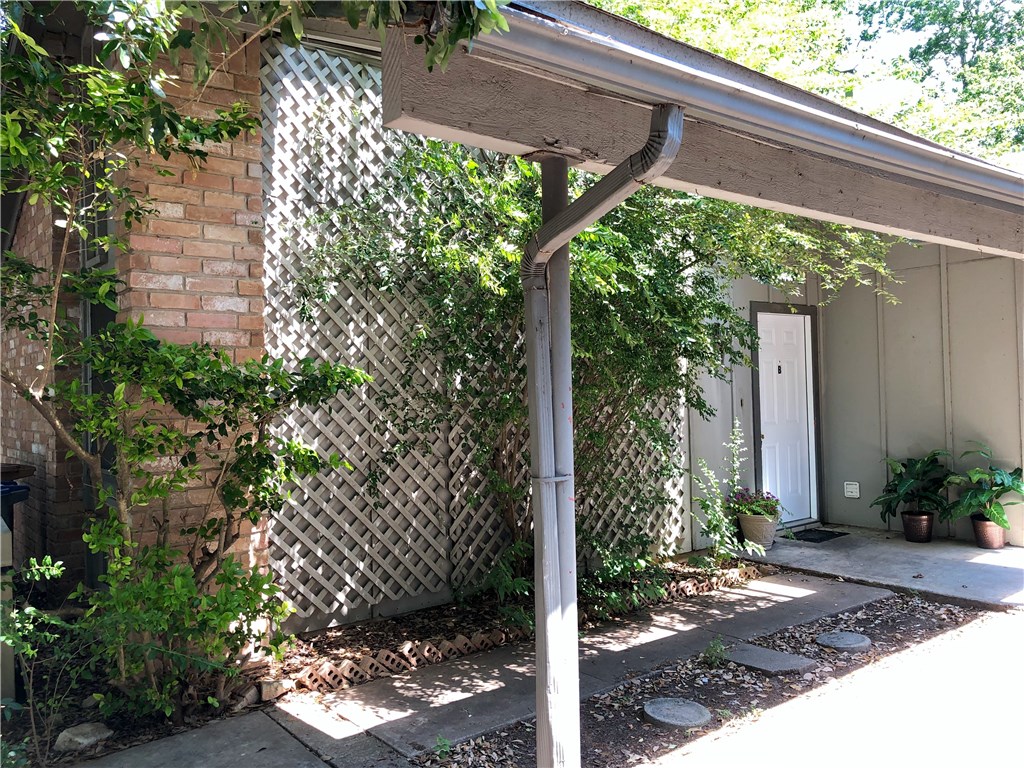 2400 Berkeley Avenue, Unit B Austin, TX 78745 - Photo 1 of 18 a backyard of a house with lots of green space