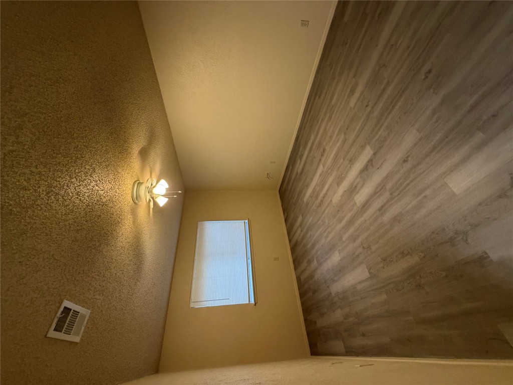 2400 Berkeley Avenue, Unit B Austin, TX 78745 - Photo 17 of 18 wooden floor in an empty room