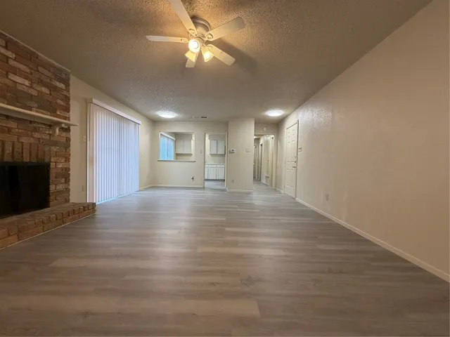 wooden floor with a chandelier