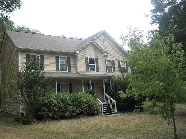 950 Parham Road Griffin, GA 30223 - Photo 1 of 1 a front view of a house with a yard