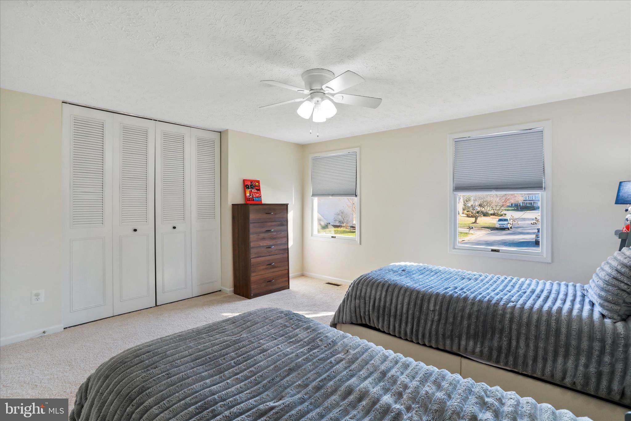 5435 Tree Line Drive Centreville, VA 20120 - Photo 30 of 51 a bedroom with a large bed and a chandelier