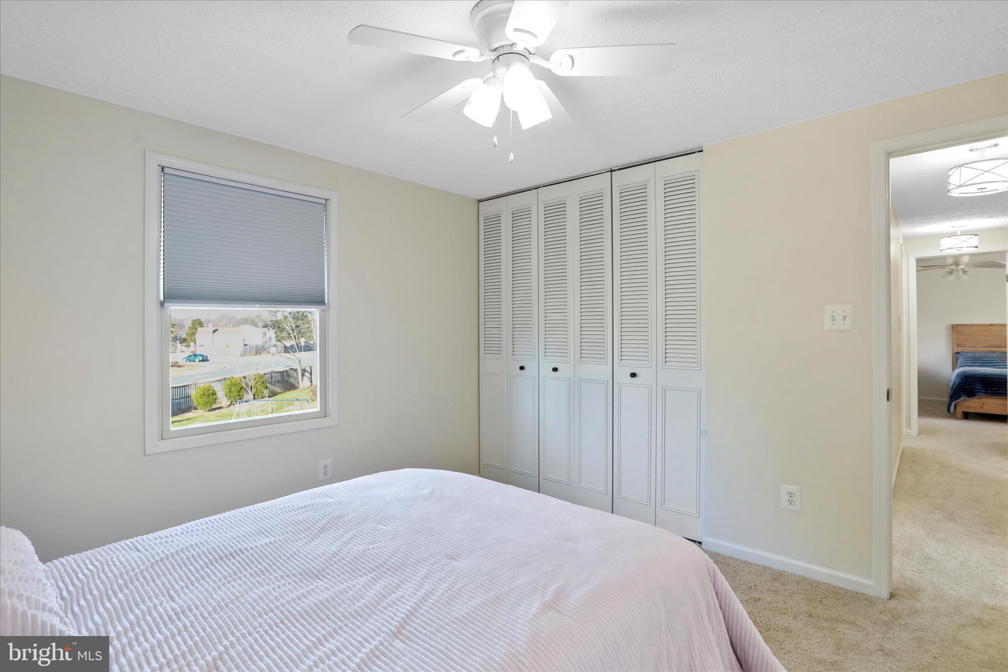 5435 Tree Line Drive Centreville, VA 20120 - Photo 33 of 51 a bedroom with a bed and a chandelier