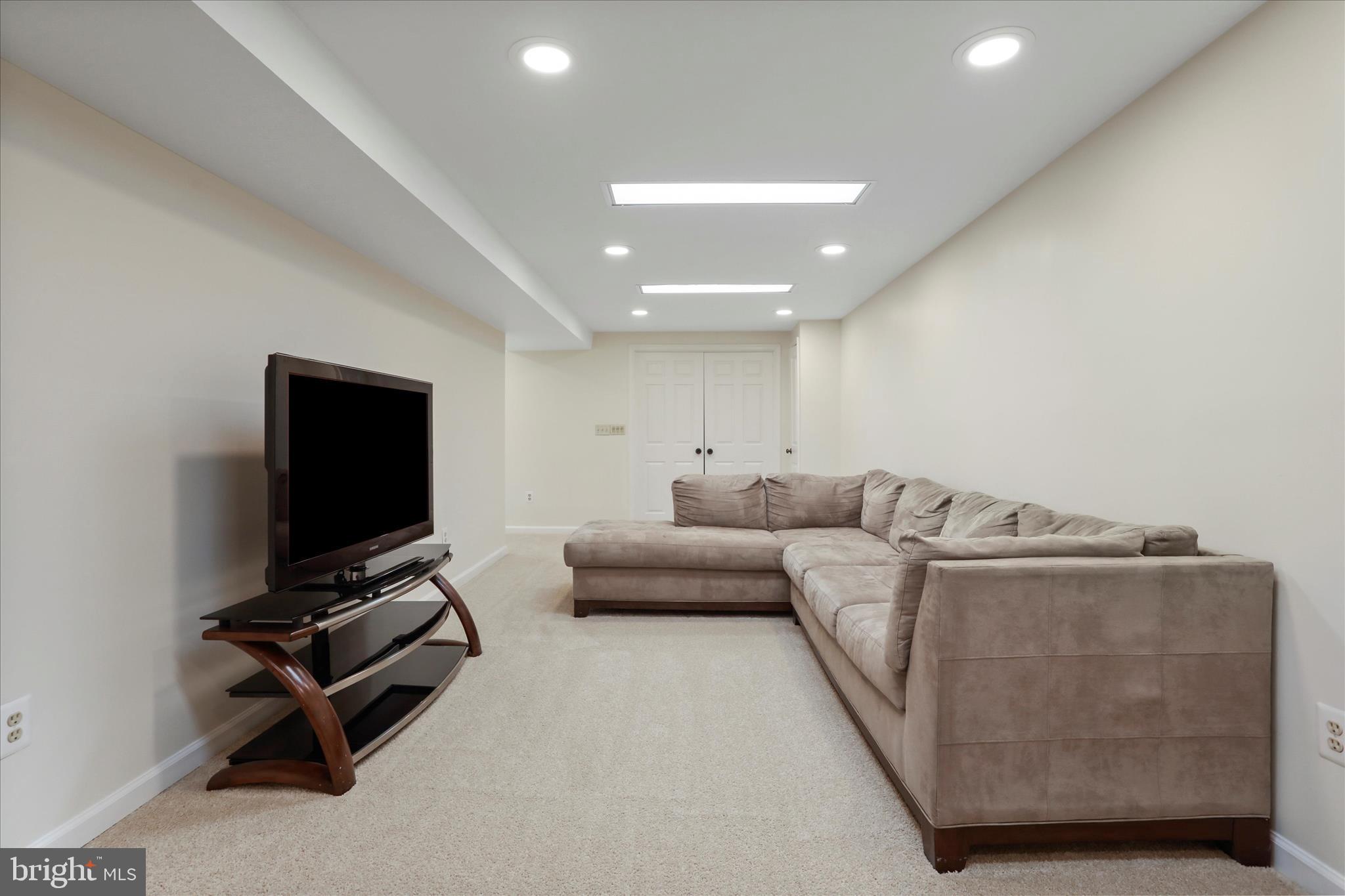 5435 Tree Line Drive Centreville, VA 20120 - Photo 38 of 51 a living room with furniture and a flat screen tv