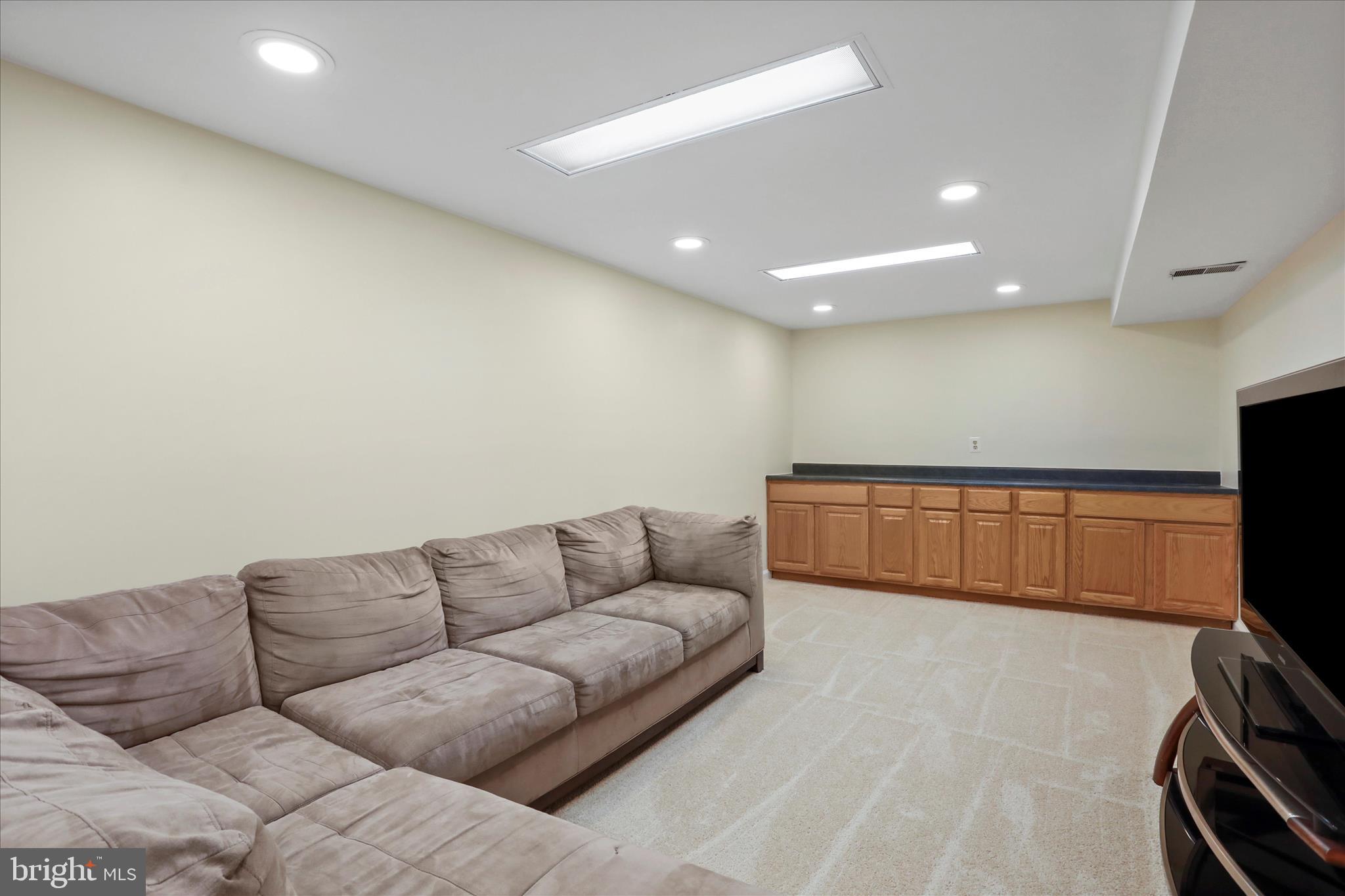 5435 Tree Line Drive Centreville, VA 20120 - Photo 39 of 51 a living room with furniture and a flat screen tv