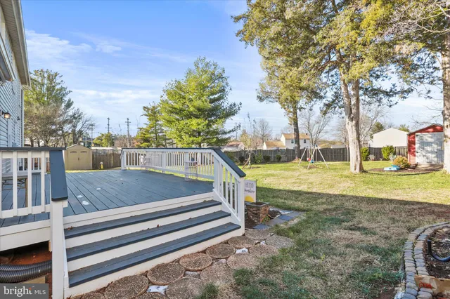 a house that has swimming pool in front of it