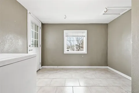 a view of an empty room with a window