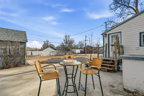 a view of a bench in the backyard