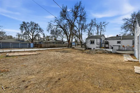 a view of a house with snow on the road