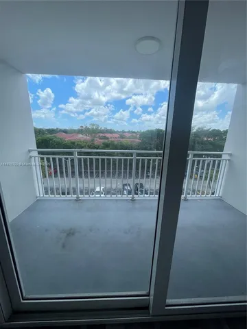 a view of balcony with furniture
