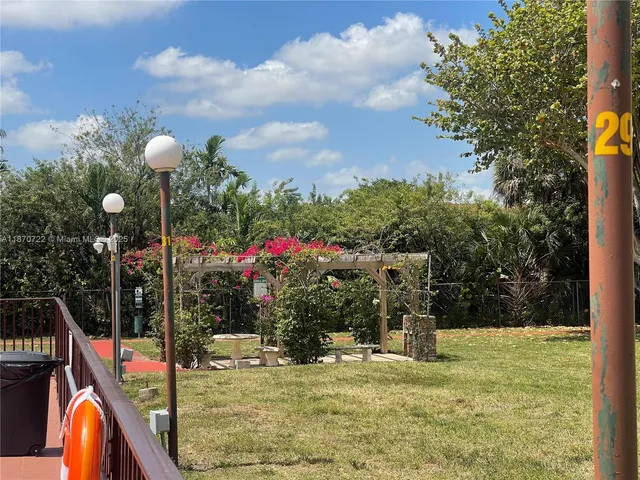 a view of a swimming pool with a bench