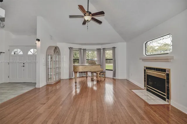 a view of livingroom with hardwood floor and a ceiling fan