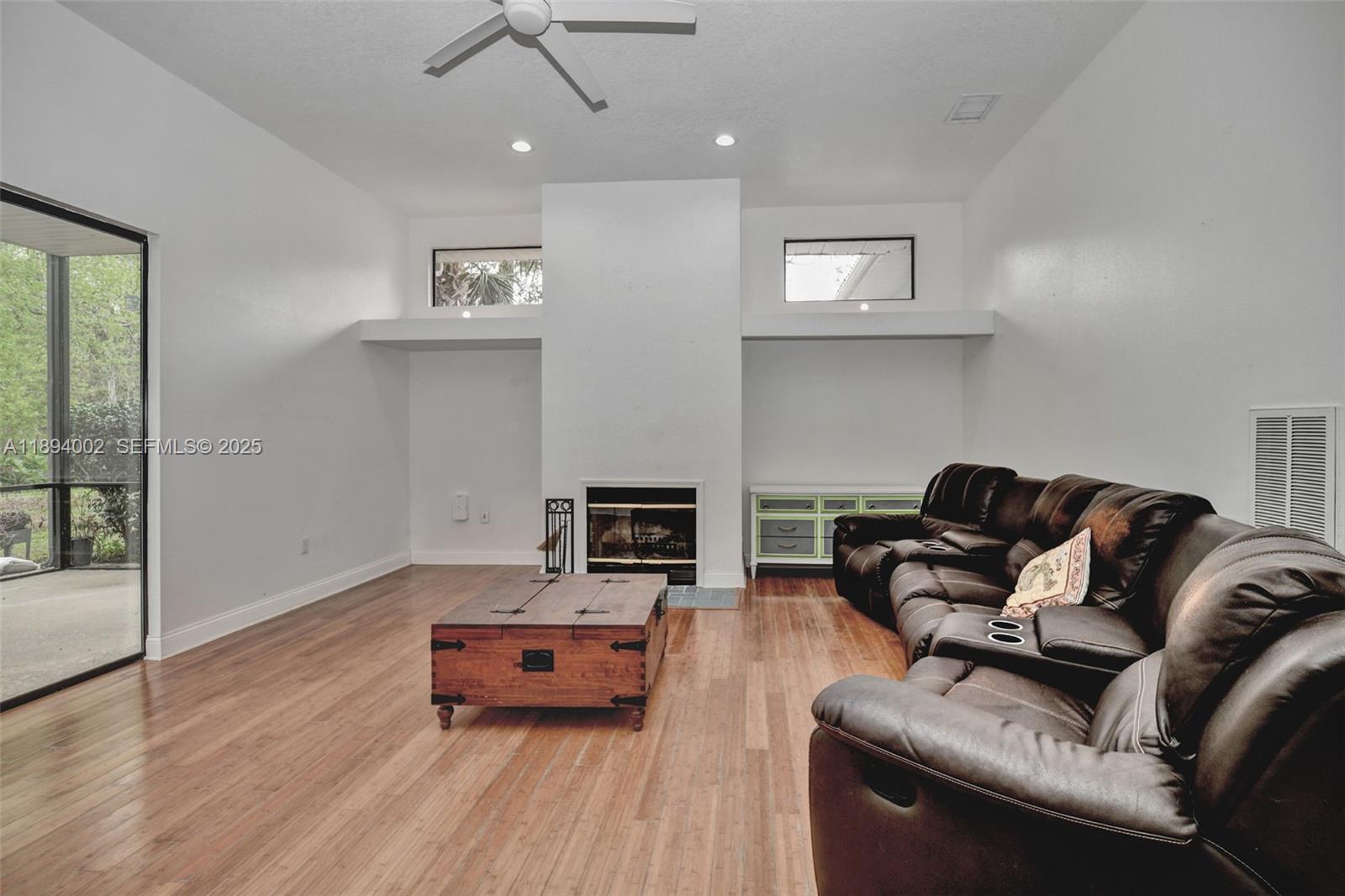 7505 Jomel Drive Spring Hill, FL 34607 - Photo 19 of 44 a living room with furniture and a wooden floor