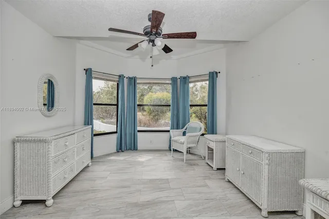 a spacious bedroom with a large bed and a window