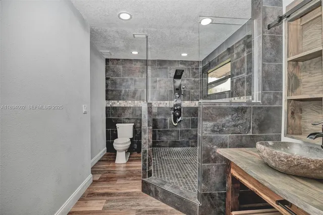 a bathroom with a sink and mirror
