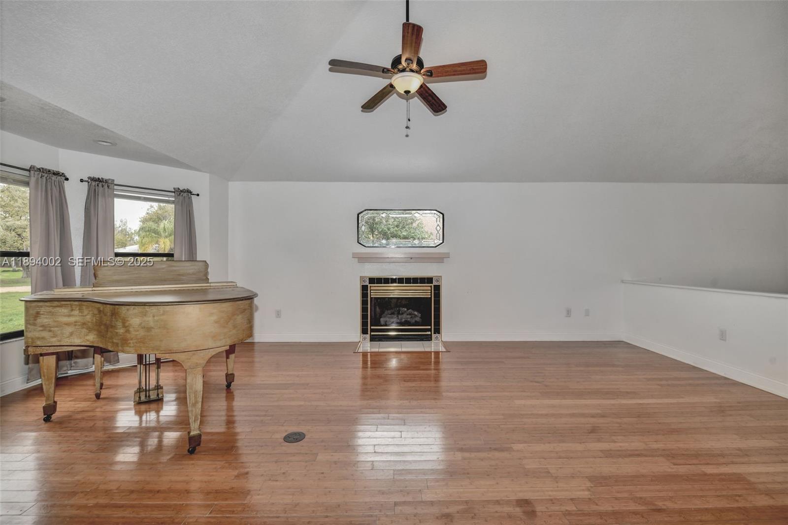 7505 Jomel Drive Spring Hill, FL 34607 - Photo 9 of 44 a room with furniture and a chandelier