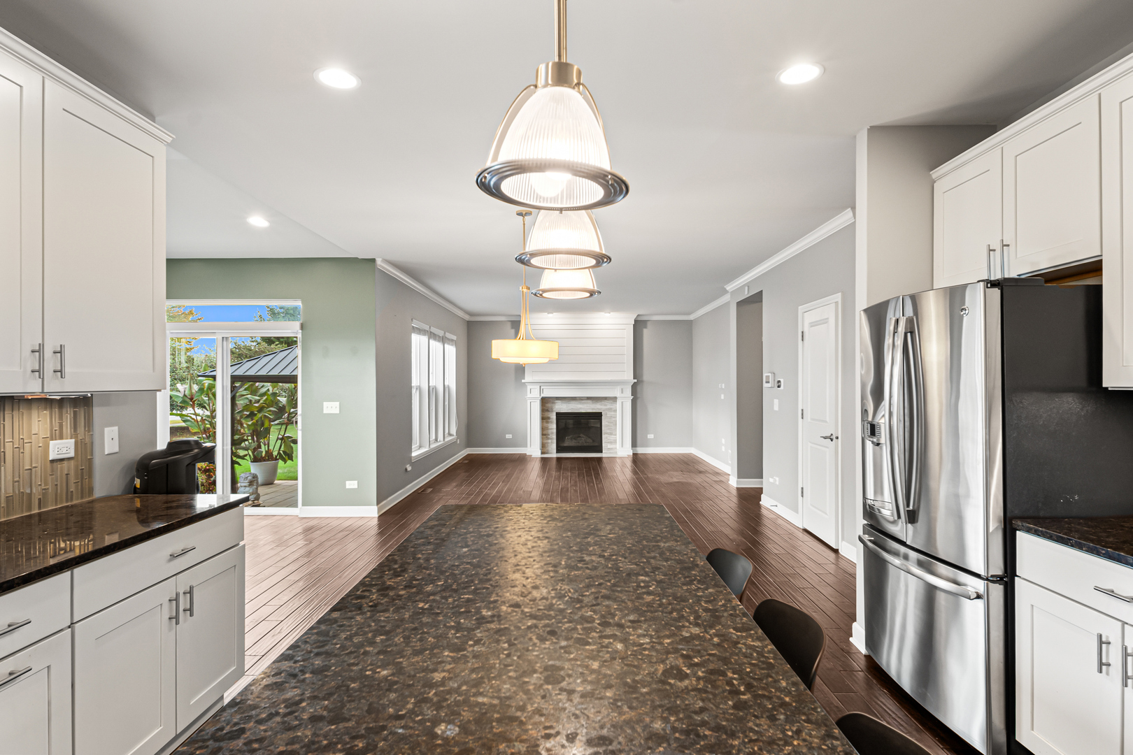 1002 Hudson Drive Joliet, IL 60431 - Photo 14 of 40 a view of a kitchen with refrigerator and windows