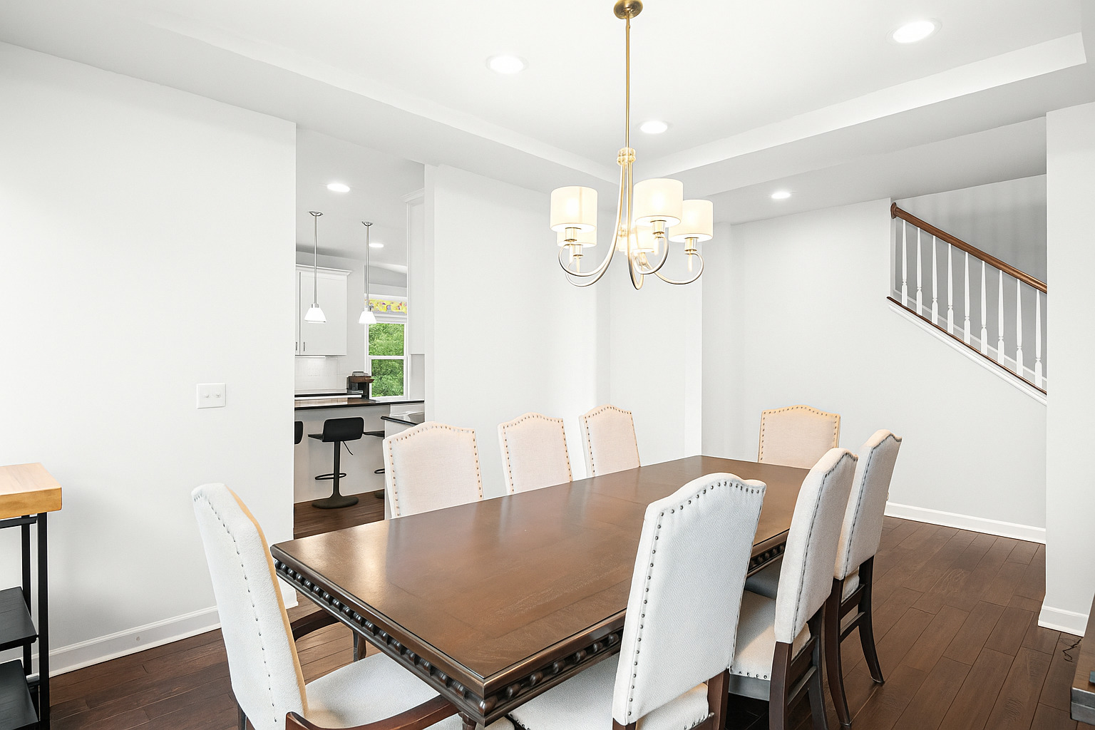 1002 Hudson Drive Joliet, IL 60431 - Photo 15 of 40 a view of a dining room with furniture a chandelier and wooden floor