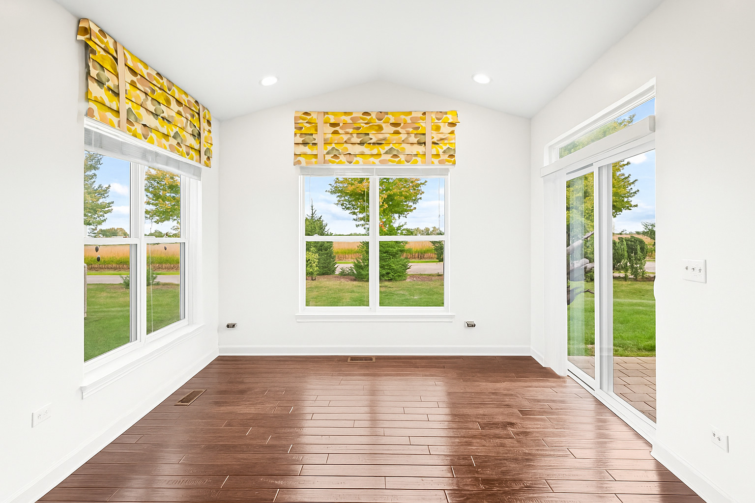 1002 Hudson Drive Joliet, IL 60431 - Photo 17 of 40 a view of an empty room with wooden floor and a window
