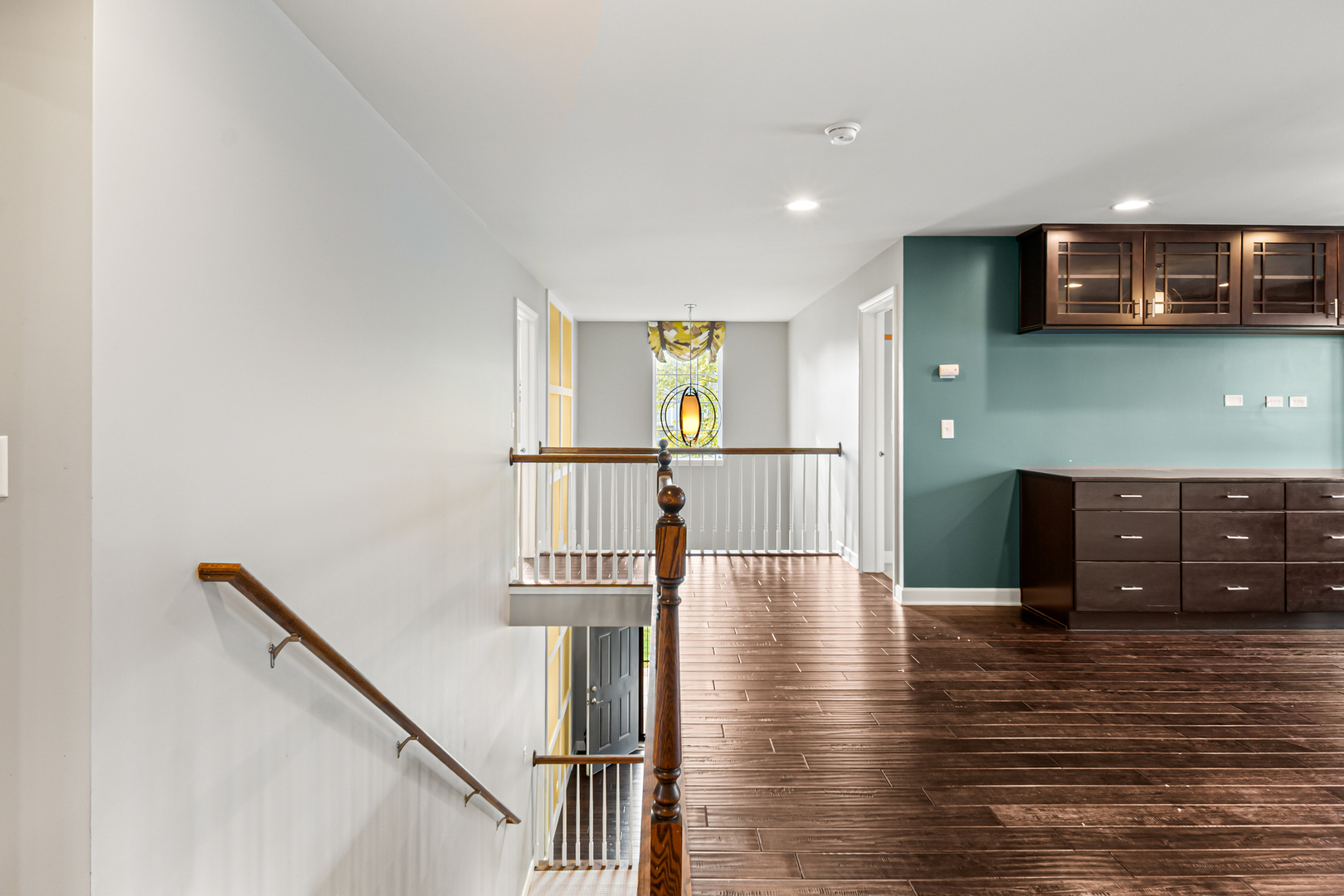1002 Hudson Drive Joliet, IL 60431 - Photo 21 of 40 a view of a hallway with wooden floor and staircase