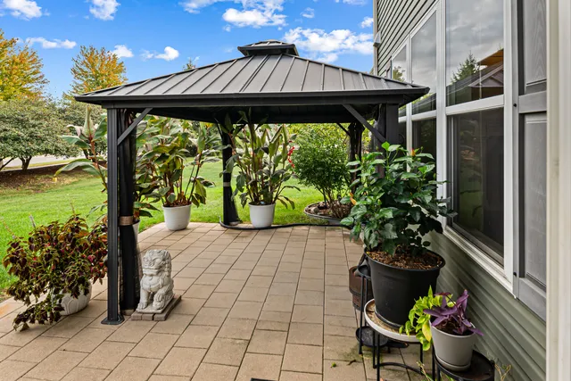a front view of a house with swing seating