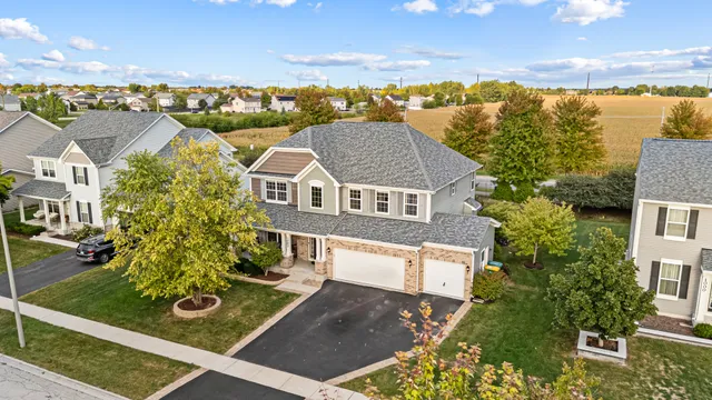 aerial view of residential houses with outdoor space and ocean view