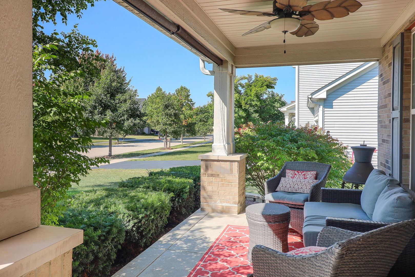 1002 Hudson Drive Joliet, IL 60431 - Photo 4 of 40 a view of a porch with furniture and a yard