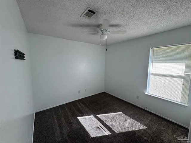 a bathroom with a sink a toilet a mirror and shower