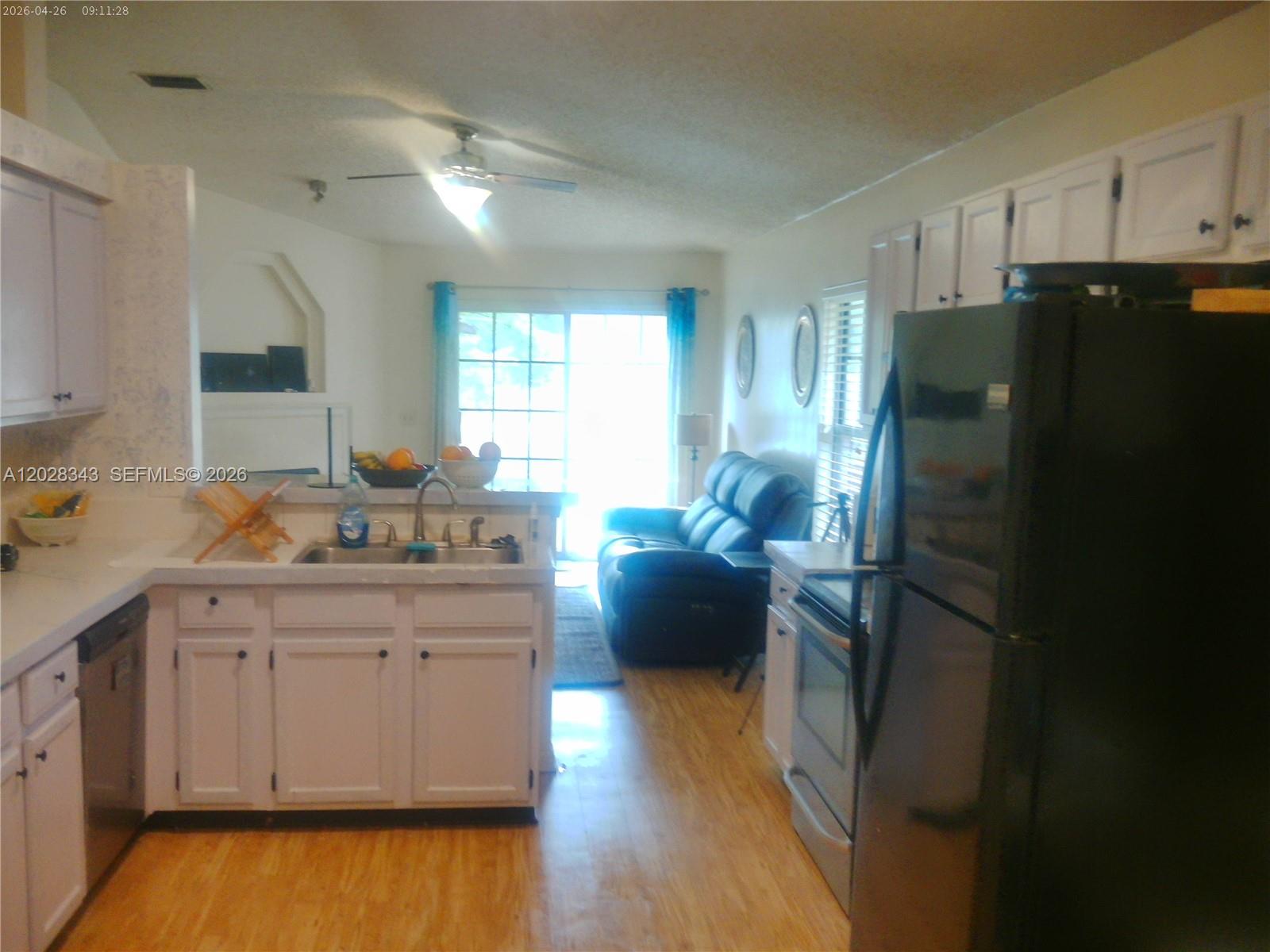 1641 Spring Oaks Lane Jacksonville, FL 32221 - Photo 23 of 44 a kitchen with a refrigerator and a sink