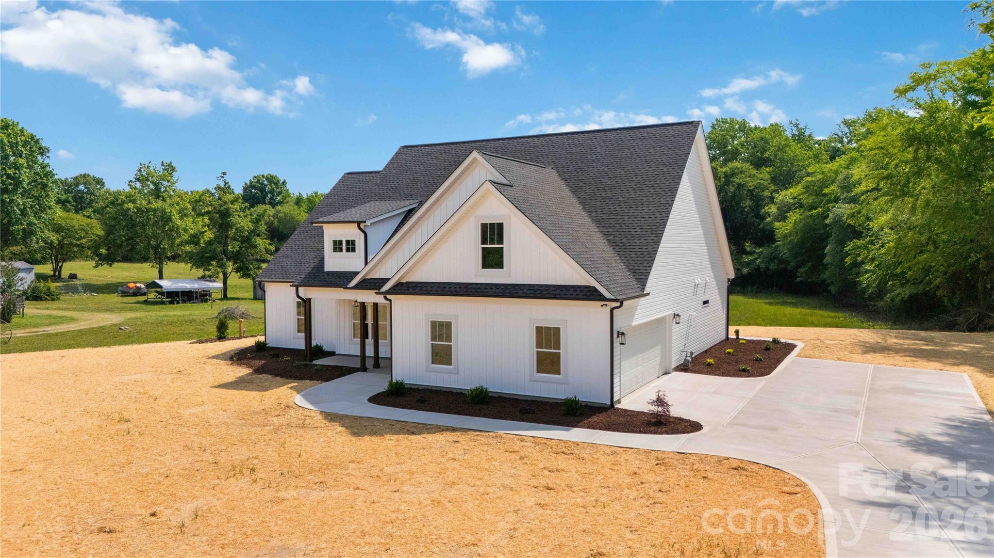 352 Adams Road Clover, SC 29710 - Photo 36 of 38 a view of house with backyard and trees in the background