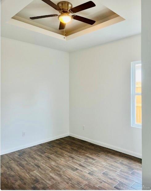 7006 North 56th Lane Mission, TX 78573 - Photo 7 of 14 an empty room with a window and a ceiling fan