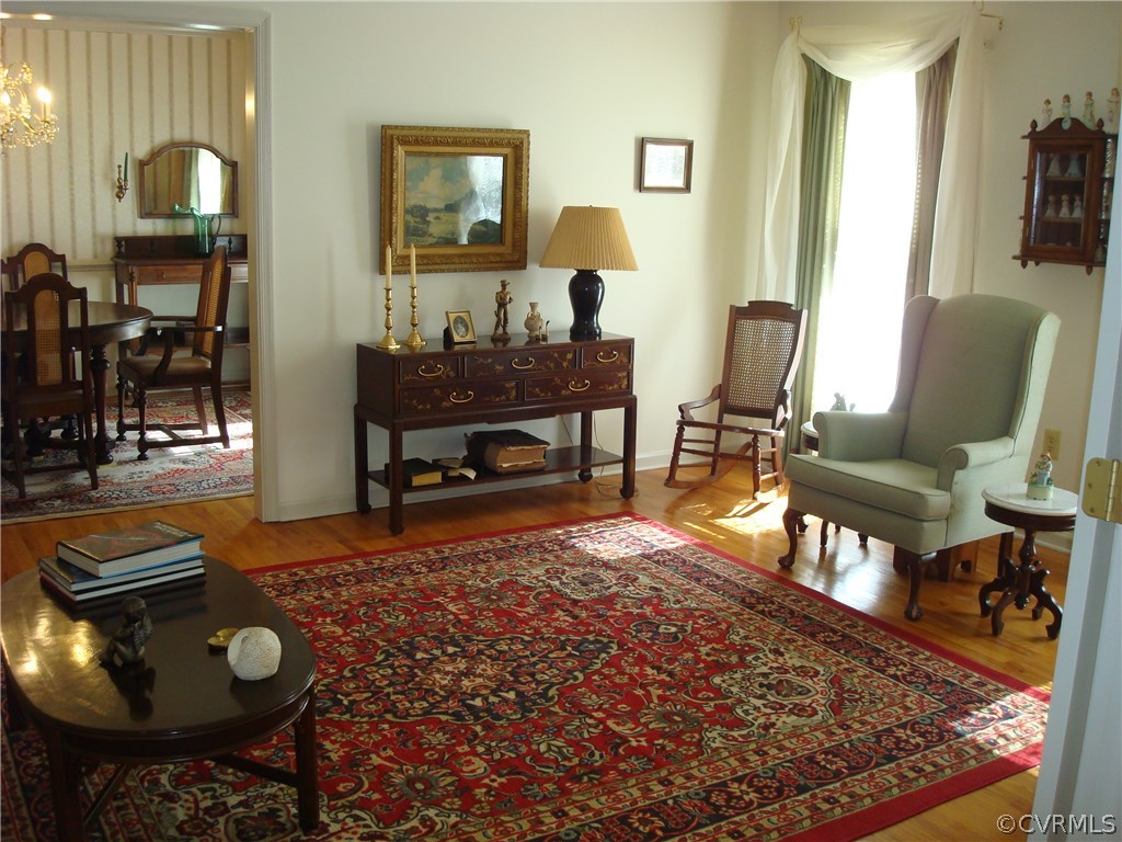 2117 Moseley Road Moseley, VA 23120 - Photo 11 of 39 a living room with furniture and a wooden floor