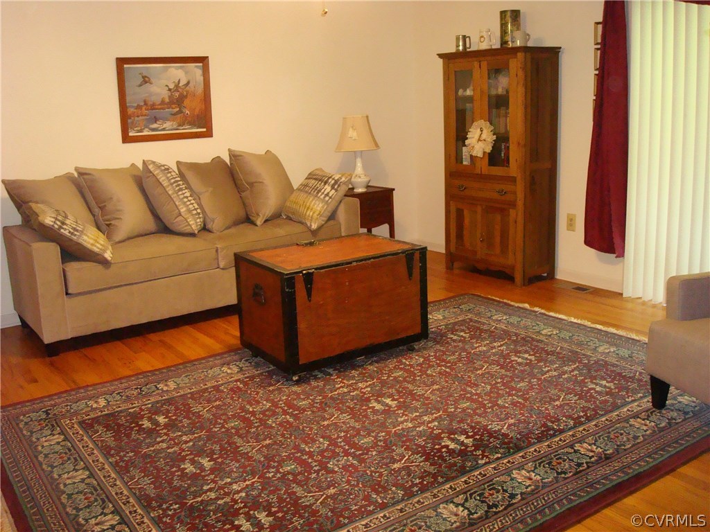 2117 Moseley Road Moseley, VA 23120 - Photo 14 of 39 a living room with furniture and a rug