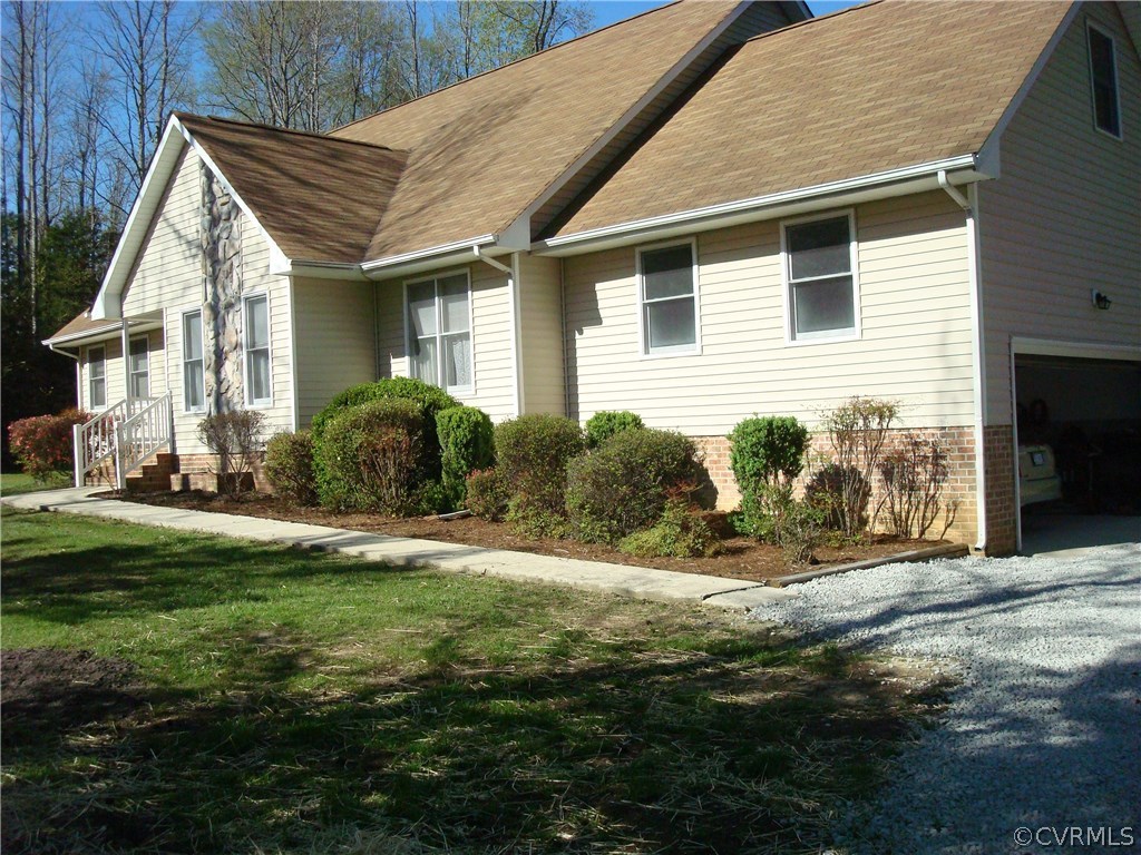 2117 Moseley Road Moseley, VA 23120 - Photo 2 of 39 a front view of a house with garden
