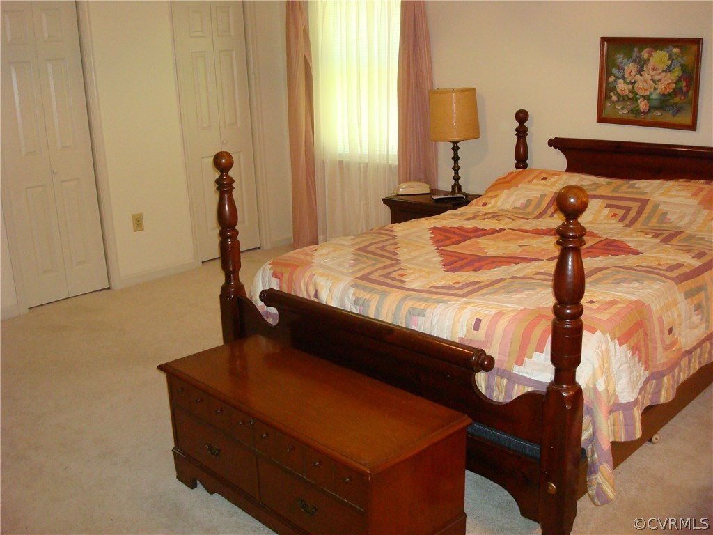 2117 Moseley Road Moseley, VA 23120 - Photo 25 of 39 a bed sitting in a bedroom next to a window