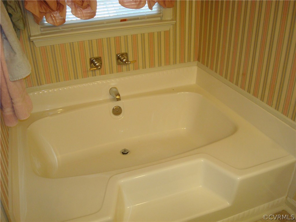 2117 Moseley Road Moseley, VA 23120 - Photo 28 of 39 a bathroom with a tub