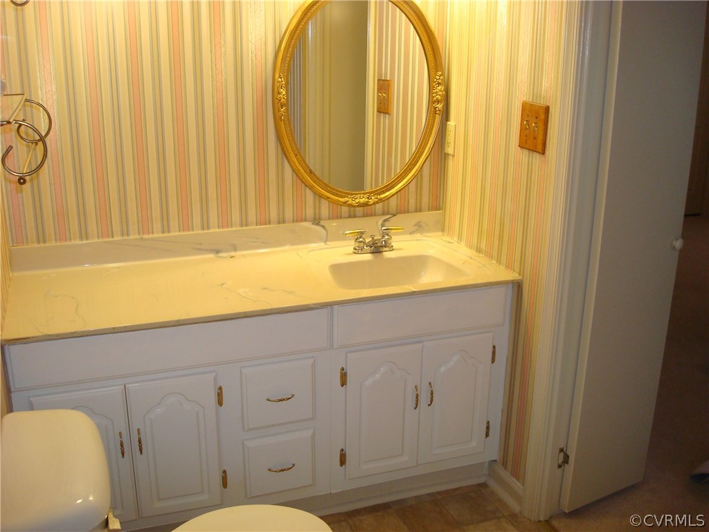2117 Moseley Road Moseley, VA 23120 - Photo 29 of 39 a bathroom with a sink and a mirror