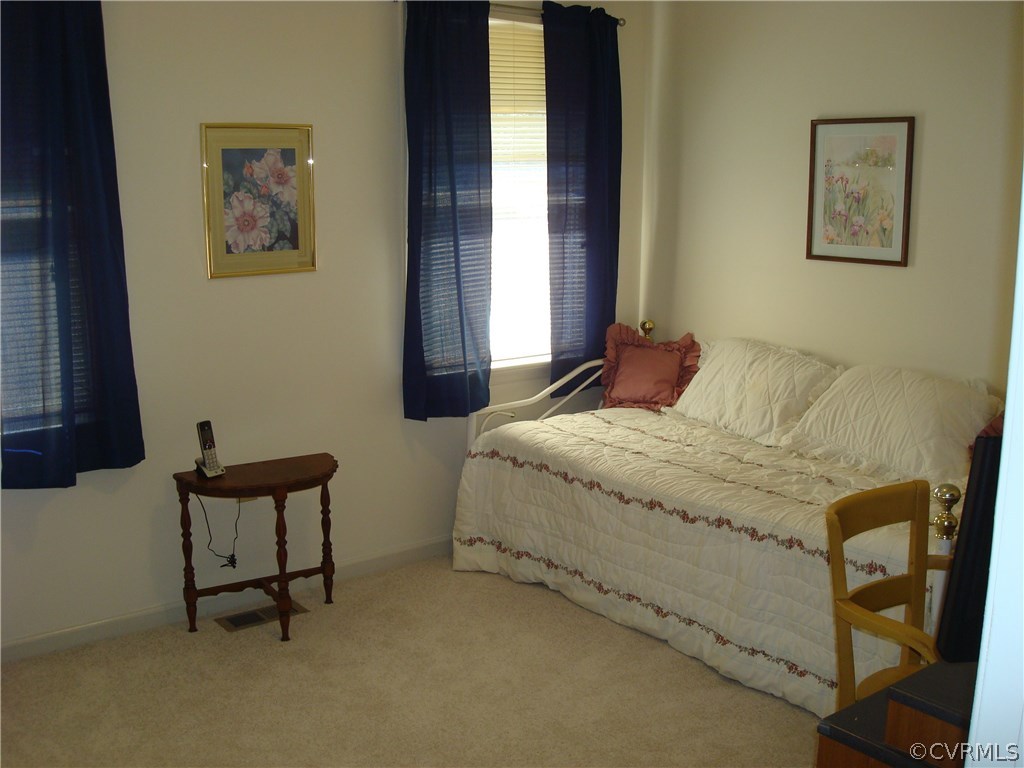 2117 Moseley Road Moseley, VA 23120 - Photo 30 of 39 a bedroom with a bed and a window