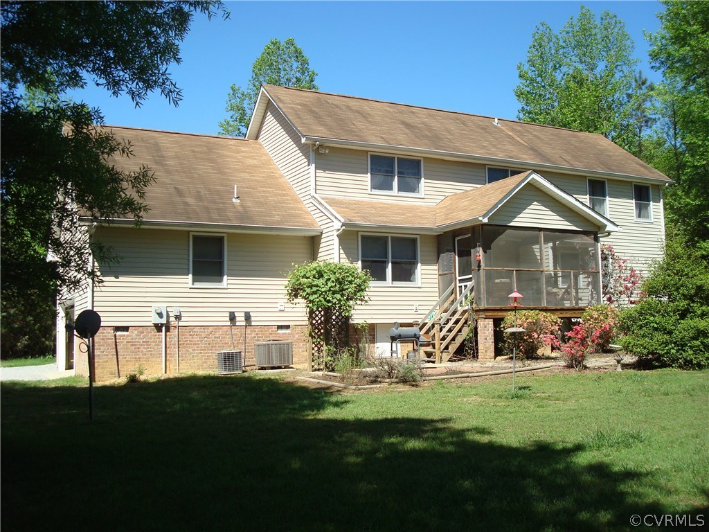 2117 Moseley Road Moseley, VA 23120 - Photo 3 of 39 a front view of a house with a yard table and chairs