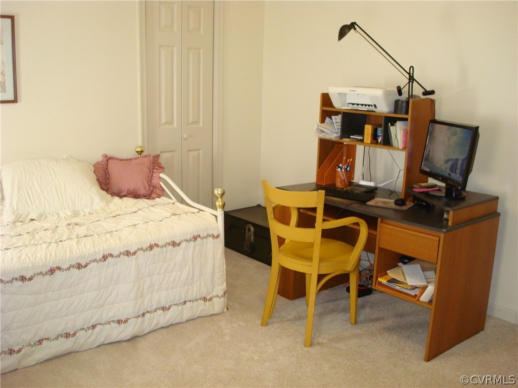 2117 Moseley Road Moseley, VA 23120 - Photo 31 of 39 a bedroom with a bed and a chair