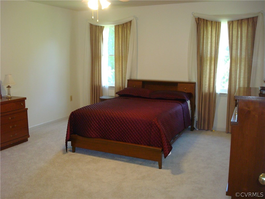 2117 Moseley Road Moseley, VA 23120 - Photo 33 of 39 a bedroom with a bed and a window