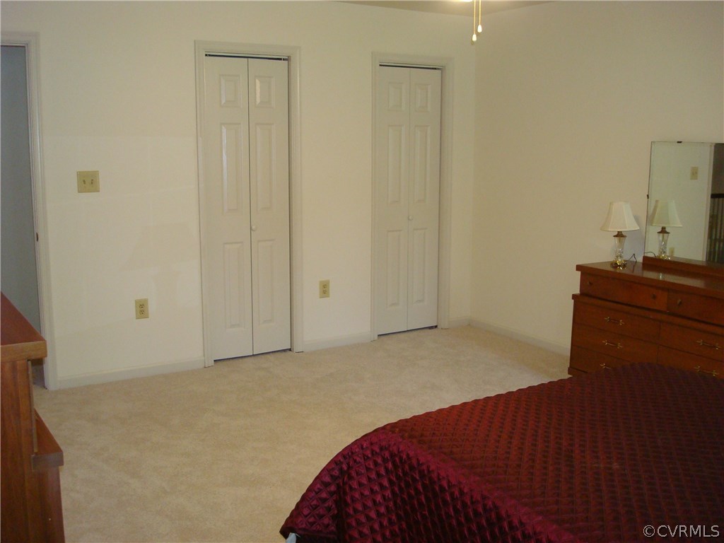 2117 Moseley Road Moseley, VA 23120 - Photo 34 of 39 a bedroom with a bed and a dresser