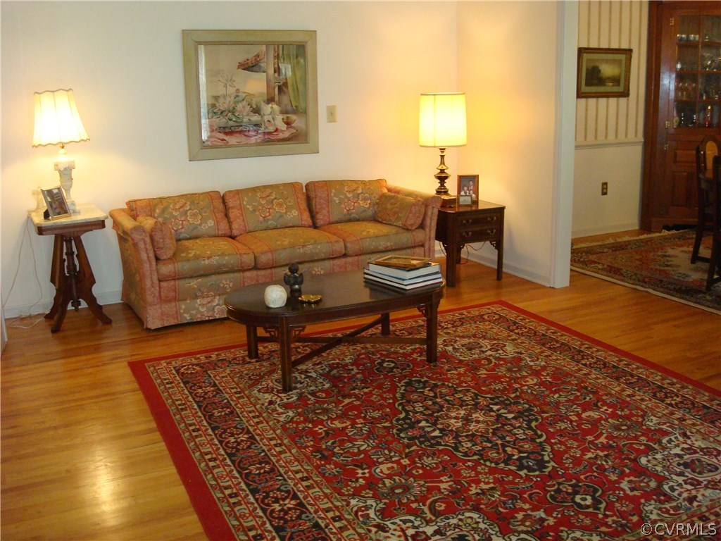 2117 Moseley Road Moseley, VA 23120 - Photo 10 of 39 a living room with furniture and a flat screen tv