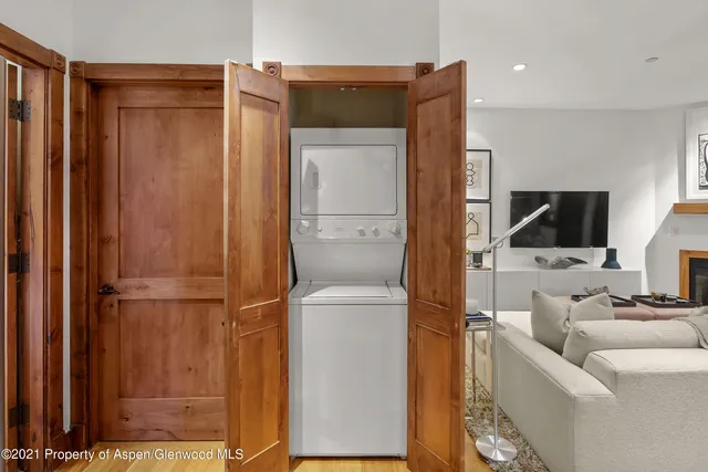 a living room with a couch and a flat screen tv
