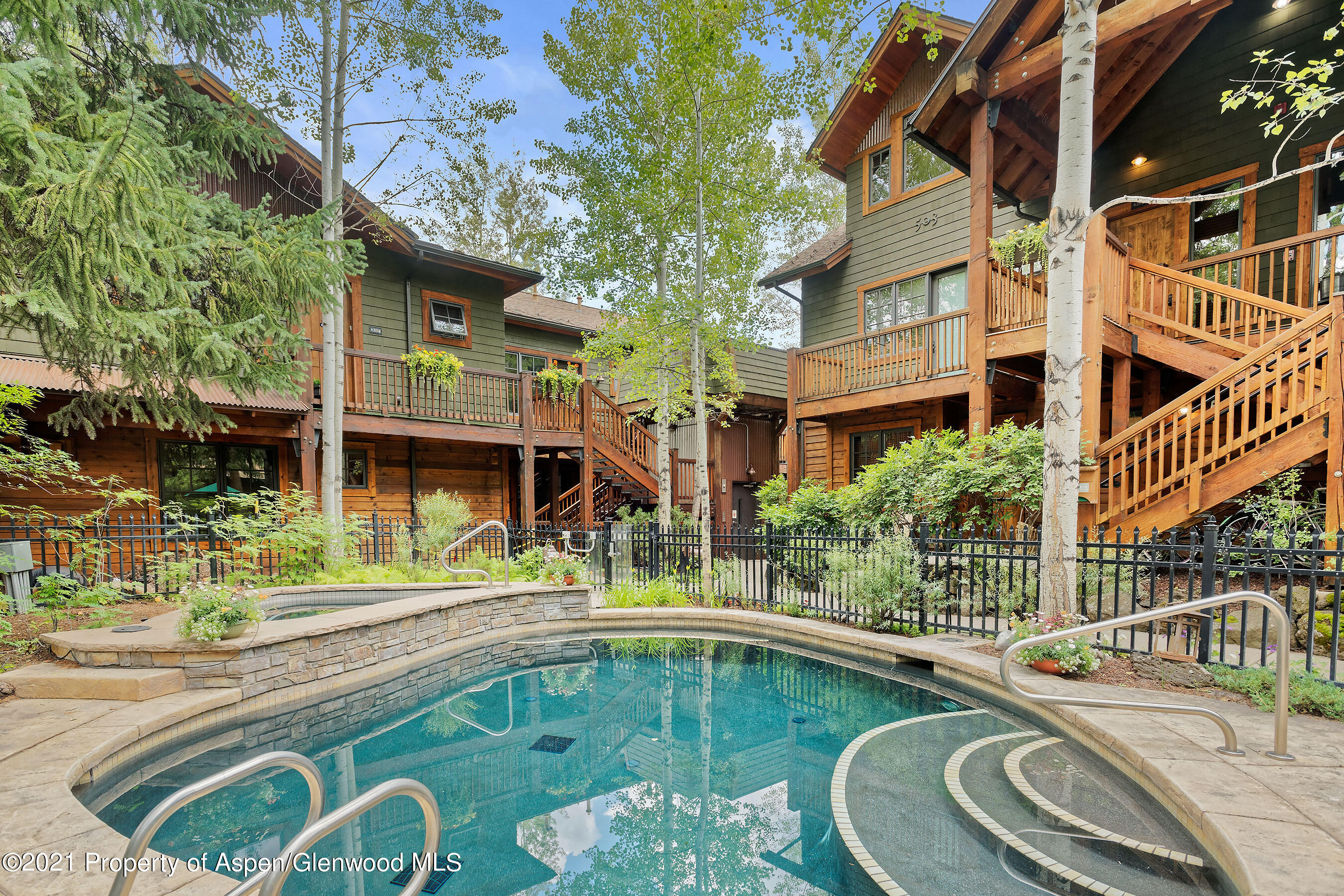 507 West Main Street, Unit C101 Aspen, CO 81611 - Photo 15 of 16 front view of a house with a swimming pool
