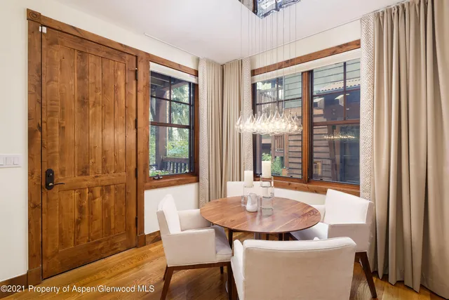 a dining room with furniture and window