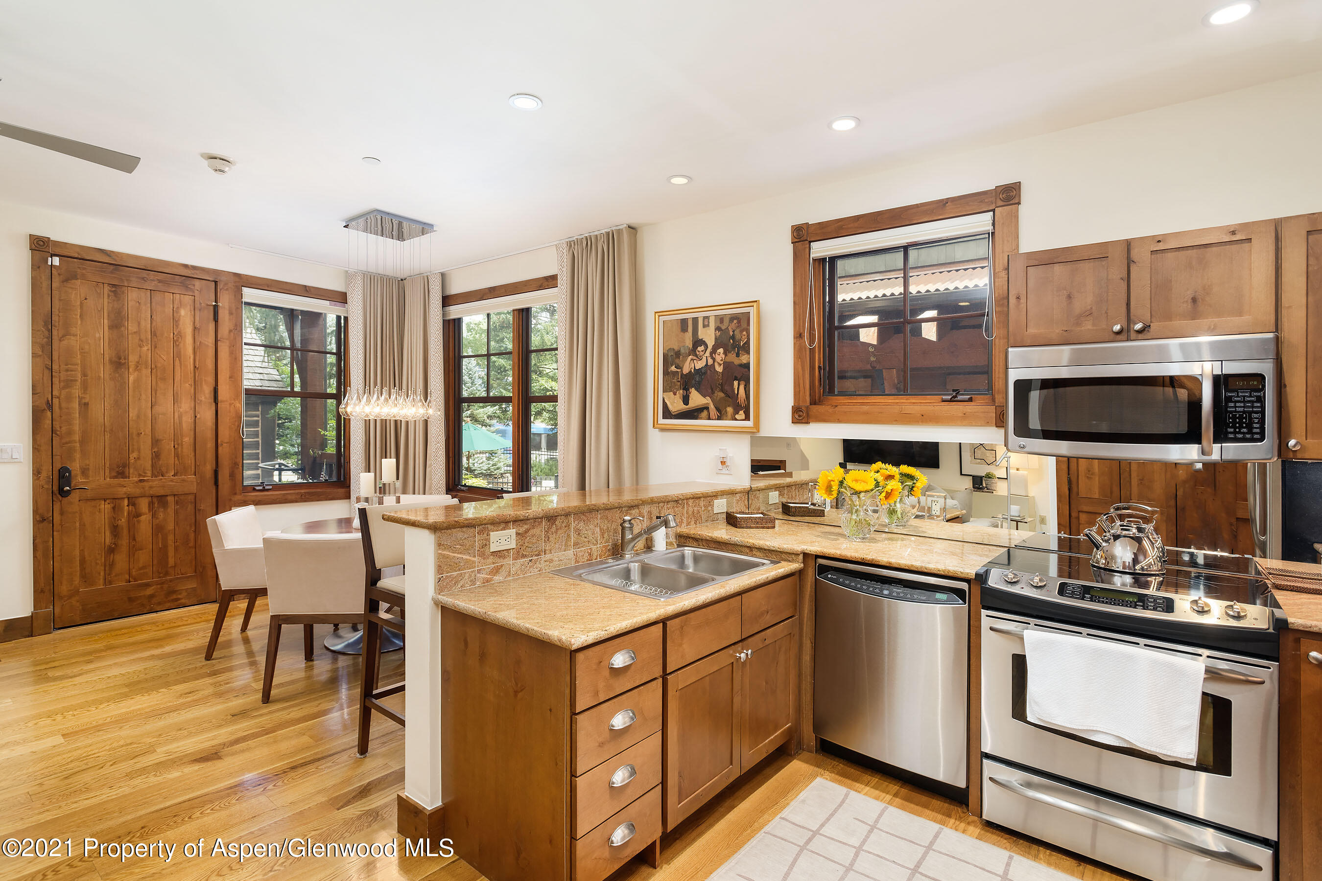 507 West Main Street, Unit C101 Aspen, CO 81611 - Photo 6 of 16 a kitchen with a sink stove and microwave