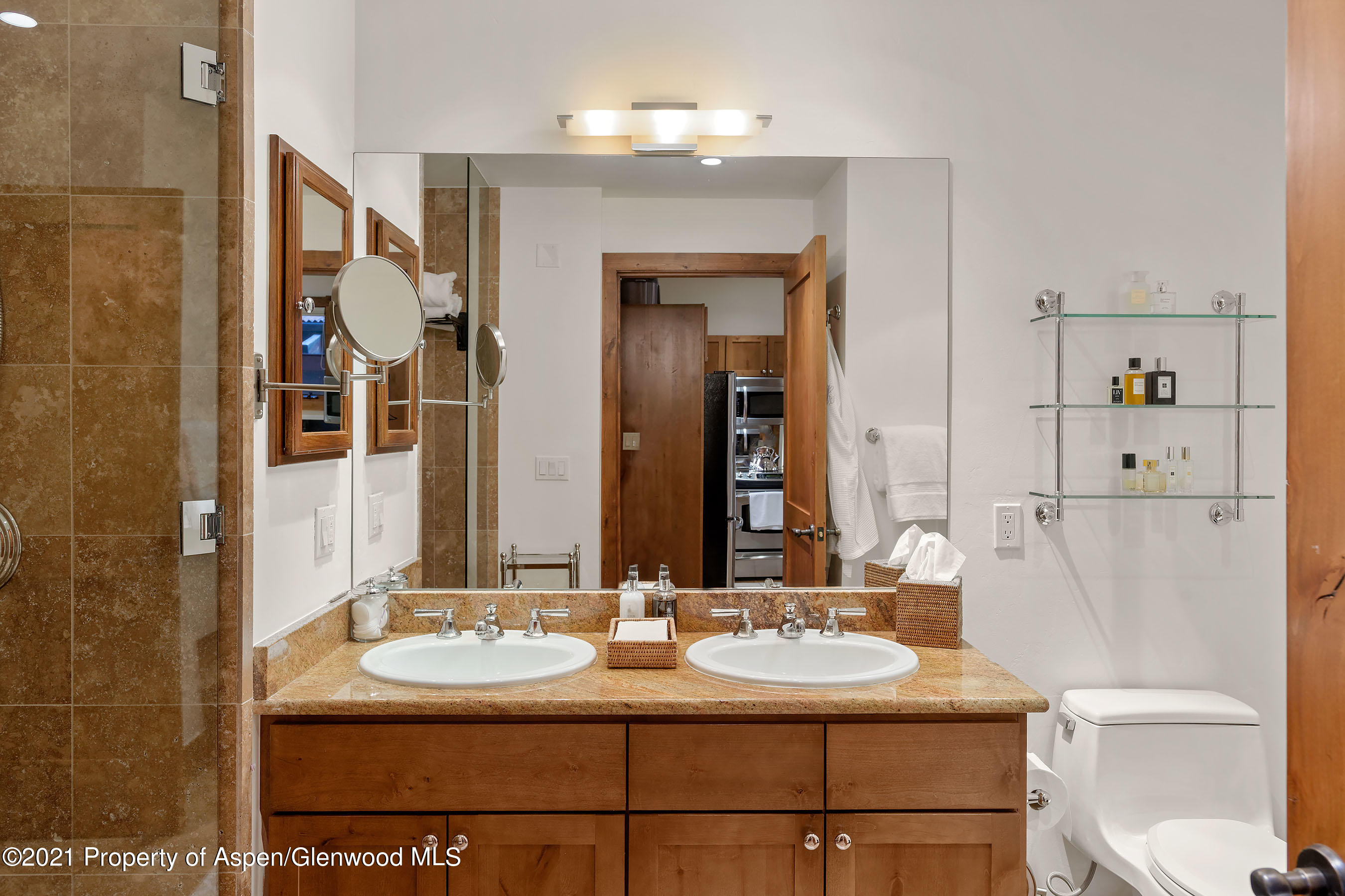 507 West Main Street, Unit C101 Aspen, CO 81611 - Photo 9 of 16 a bathroom with a sink and a mirror