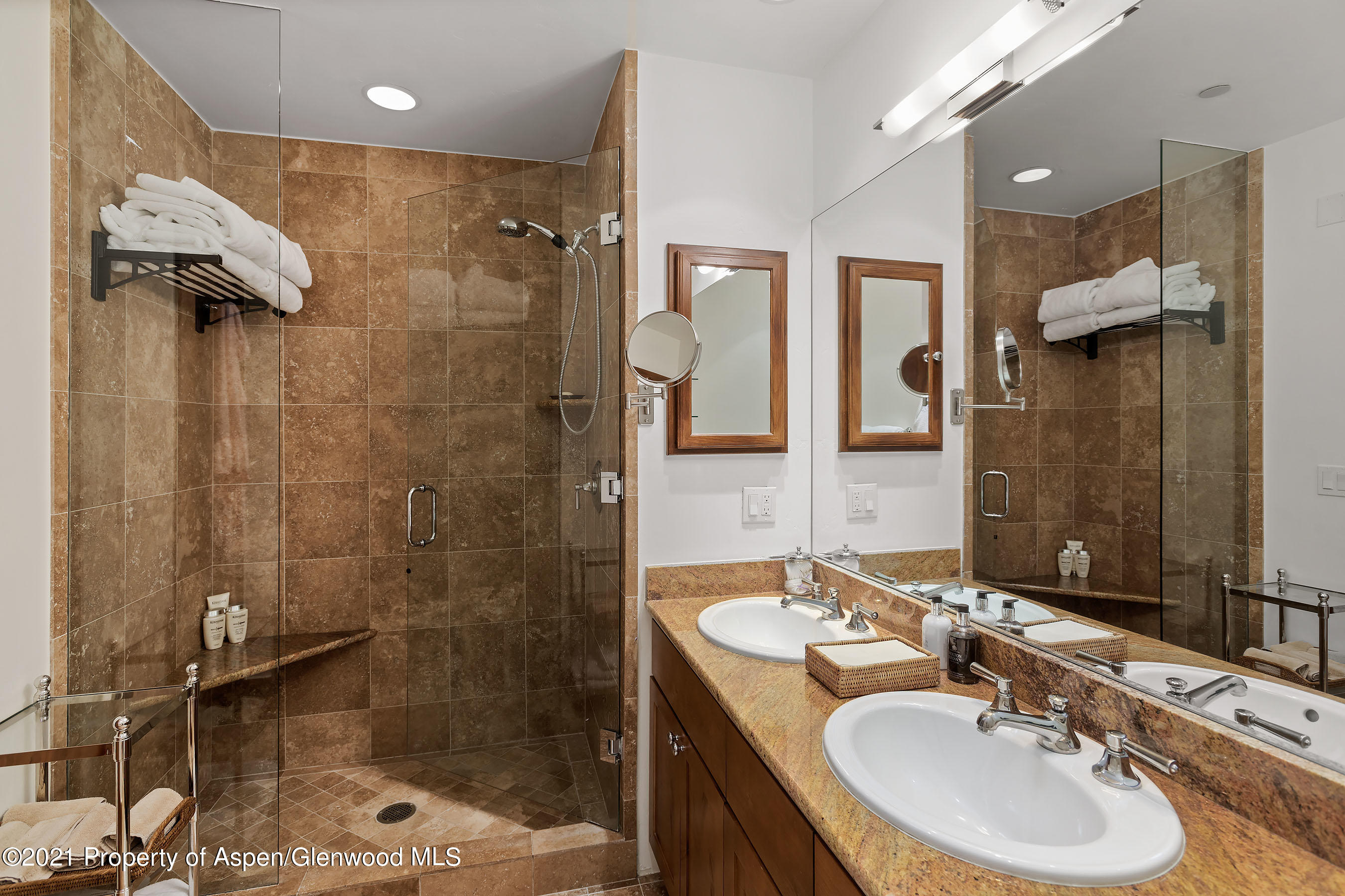 507 West Main Street, Unit C101 Aspen, CO 81611 - Photo 10 of 16 a bathroom with a sink shower and a mirror